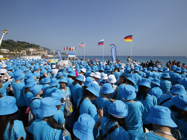 O empresário chinês Li Jinyuan pagou quatro dias de férias na França para os seus funcionários (Foto: AFP Photo/Valery Hache)