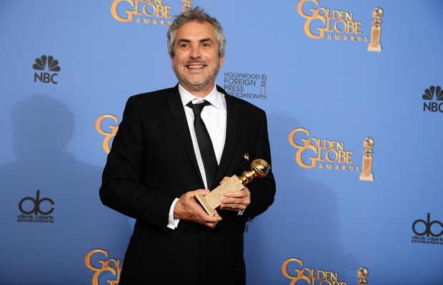 O diretor mexicano Alfonso Cuarón é favorito ao prêmio de melhor direção pelo trabalho em "Gravidade" (Foto: Jordan Strauss/Invision/AP)